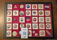 Overall view of display case showing full set of 36 buttons