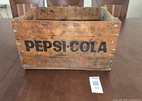 Front view showing Pepsi-Cola logo and wood condition