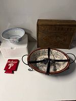 Group shot of serving dish, bowl, crate, koozie