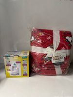 Bottle warmer box and packaged blanket side by side