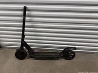 Full side view of Evercross scooter folded upright