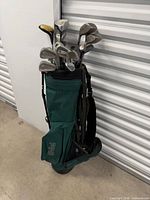Full view of green golf bag with clubs