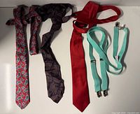 Lot overview showing three neckties and suspenders