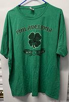 Full front view of green Philadelphia clover graphic T-shirt