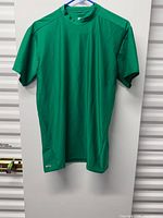Front view of green Starter athletic shirt