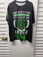 Front view of black T-shirt with Irish slogan graphic