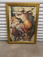 Entire framed print leaning against metal wall