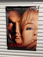 Full view of poster hanging with lead actors and title visible