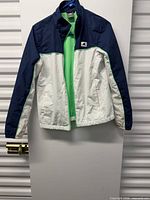 Front view of jacket hanging showing color placement and condition