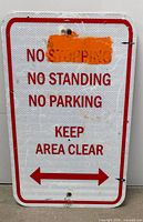 Front view of full sign showing text, border and paint residue