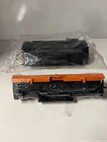 Two sealed toner cartridges side by side