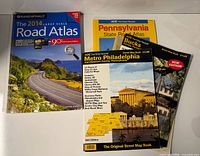 Group shot of four road and street atlases