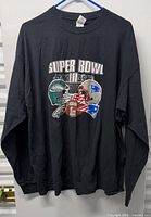 Full front view of black long-sleeve Super Bowl LII T-shirt on hanger