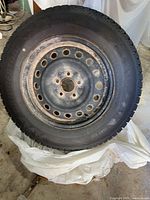 Full view of mounted tire showing overall condition and tread