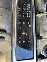 Top view of range showing four burners, continuous cast-iron grate and control panel