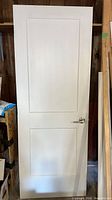Front view of white two-panel Shaker door slab