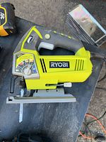 Left side view of Ryobi corded jigsaw with blade installed