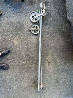 Full view of 56 in aluminum clothesline block and tackle system on ground