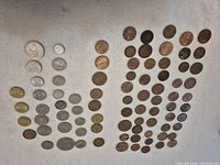 All 84 coins arranged by size and colour