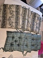 Group view: 6 floral-stripe cushions stacked above 4 plaid cushions