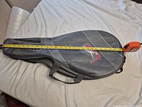 Bag measured lengthwise with tape showing 26.5 in