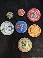 All seven buttons laid out on dark background