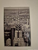 Front view of matted black-and-white Chrysler Building photo
