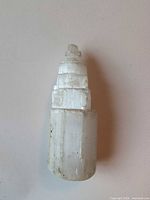 Full view of selenite tower showing stepped carving and overall condition