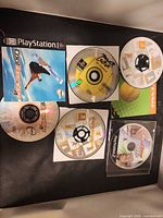 Overview of all five game discs and one cover insert