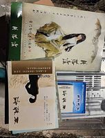 Overview of all components: two booklets, blue disc case, outer folder