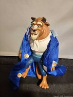 Front view of Beast figure wearing coat