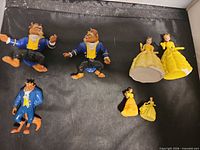 Overview of six Disney Beauty and the Beast figurines