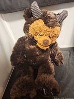 Full view of Beast plush toy showing overall appearance, fur, horns