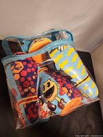 Set stored in zippered clear bag showing ball and pins