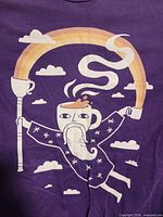 Front of purple T-shirt with coffee wizard and rainbow graphic