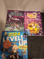 Front covers of all three books displayed upright