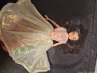 Full view of doll with iridescent gown