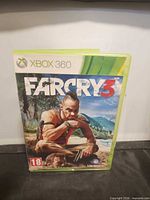 Front view of Far Cry 3 Xbox 360 case showing cover art and PEGI 18 rating