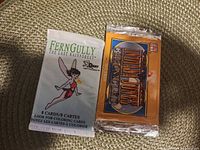 Front view of both sealed trading card packs