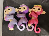 Front view of three Fingerlings Baby Monkeys showing colours and facial details