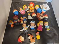 Group shot of all Fisher-Price Little People figures, shuttle, horse, bear