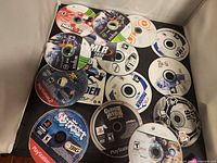 All fourteen loose game discs displayed on flat surface