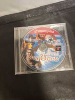 Front view of God of War PS2 disc inside clear jewel case