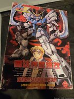 Front of the original box showing Gundam Sandrock Custom artwork and Bandai branding