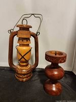 Lantern and candle holder side by side