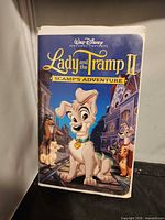Front view of Disney Lady and the Tramp II VHS in clamshell case
