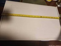 Top view of assembled sample box with tape measure showing 19-inch length