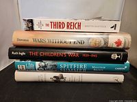 Spine view of all five books stacked