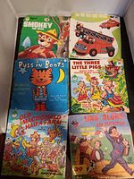 All six records laid out showing illustrated sleeves