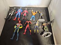 All ten figures laid flat for full lot overview